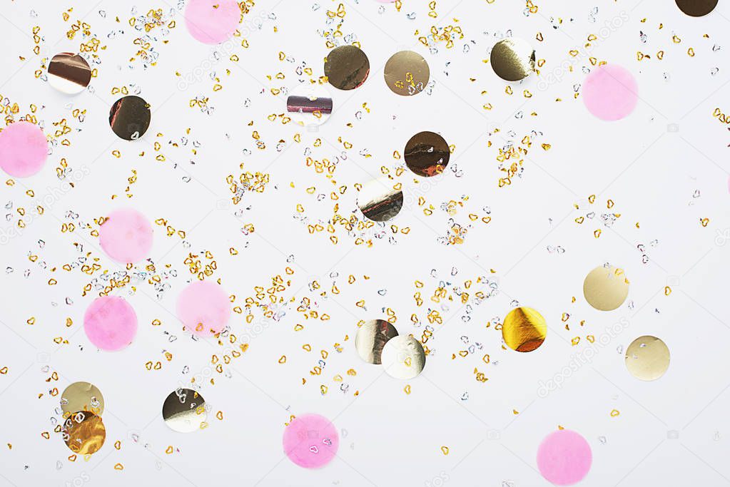 Universal festive background pink gold with sparkles, confetti and glitter. Horizontal, copy space. Concept for any project,