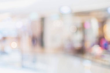 İnsanların bokeh ışıkları ile mağaza alışveriş merkezinde alışveriş arka plan bulanık