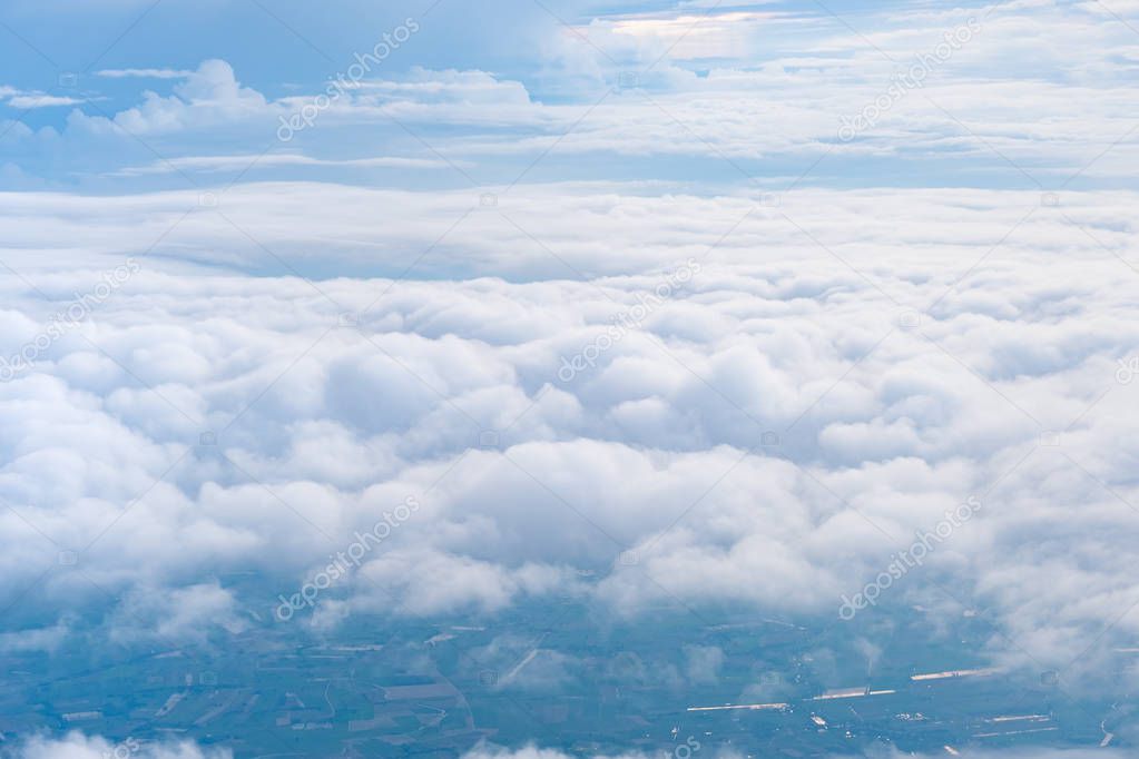 Big Blue sky and Cloud and city under cloud Top view from airplane window,Nature background