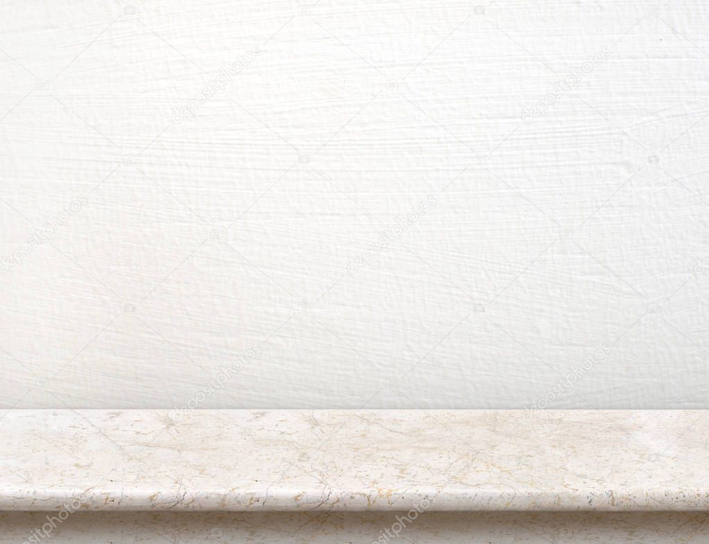 Empty cream marble table top with white concrete wall,Mock up for display or montage of product,use as background