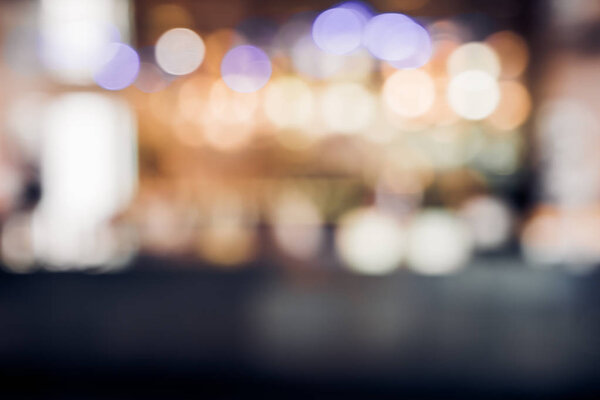 Blur background of restuarant bar counter at night with bokeh light