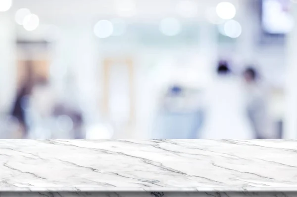 Empty white marble table top with blur patient waiting for doctor at hospital with bokeh light at background,Mock up template for display of your design,Banner for advertise of product,panorama view.