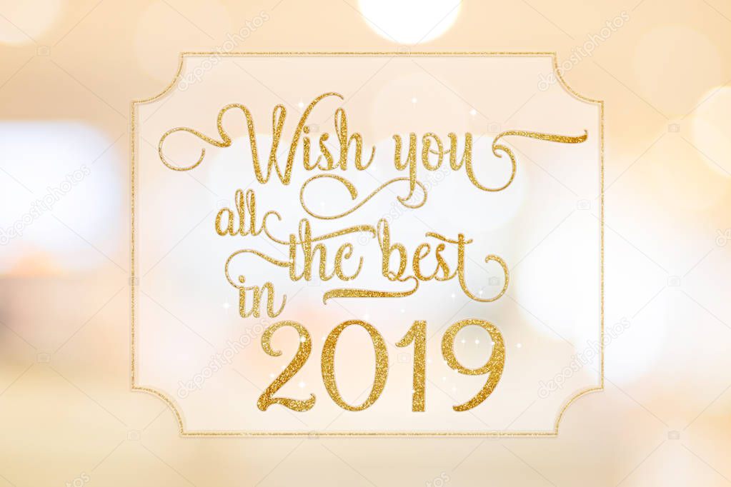 Wish you all the best in 2019 gold glitter word on white frame at abstract blurred bokeh light background, Holiday concept
