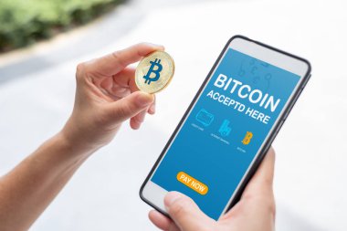 Altın bitcoin ödeme faturası çevrimiçi mağaza telefon app.digital currency.banking finansal technology.accepted bitcoin burada tutan el