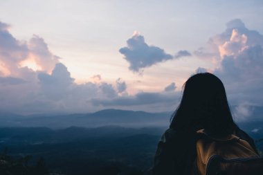 Back of backpacker looking at view in sun rise time at top of mountain.nature morning view 