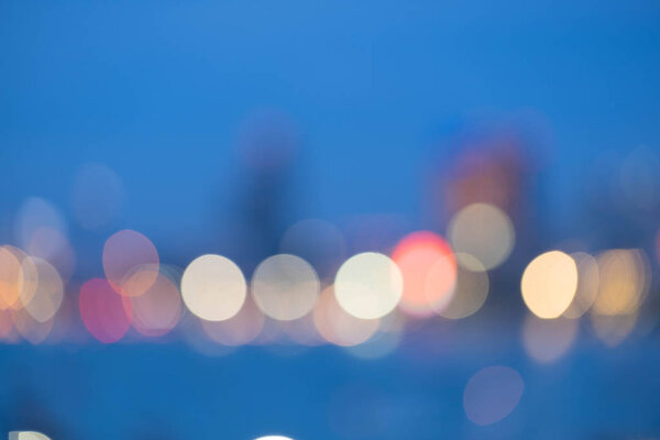 Blurred abstract background of office building at sea harbour at evening time,urban life