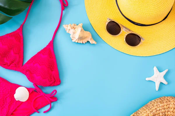 summer blue banner with yellow hat ,sunglasses and pink bikini o