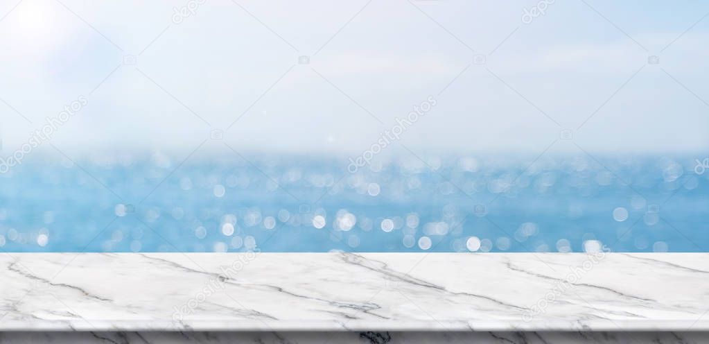 Empty white marble table top with blur blue sky and sea boekh ba