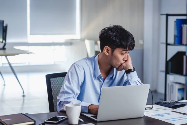 asian businessman get stress and thinking when working with lapt | Stock  Images Page | Everypixel