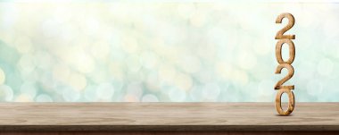 Mutlu Yıllar 2020 kahverengi ahşap masa üzerinde pırıl pırıl yıldız ile ahşap