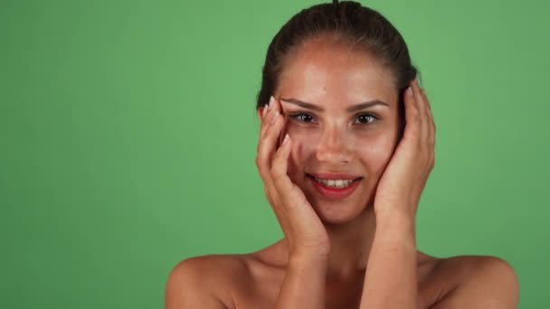Gorgeous happy woman touching her face gently smiling to the camera — Stock Video