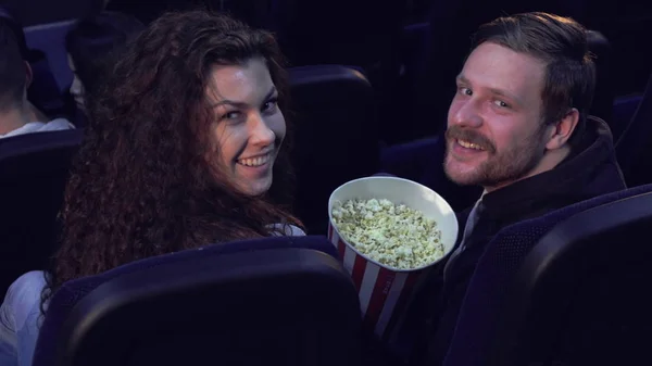 Couple turns their faces back at the movie theater — Stock Photo, Image