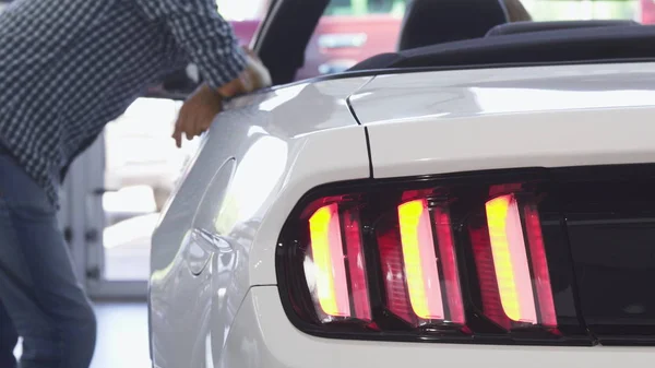 Close up of car lights flashing on a new convertible