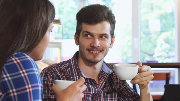Close up shot of a handsome man having coffee with his girlfriend — Stock Photo, Image