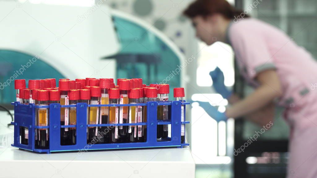 Blood samples in test tubes on the foreground copy space on the side