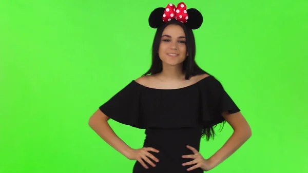 Beautiful woman wearing fluffy mouse ears posing playfully — Stock Photo, Image