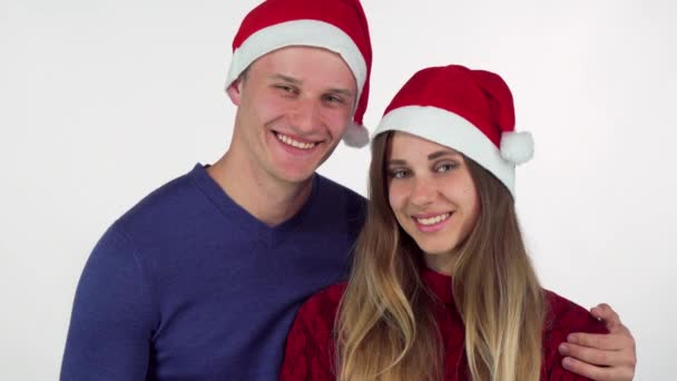 Happy handsome man giving Christmas present to his beautiful girlfriend — Stock Video