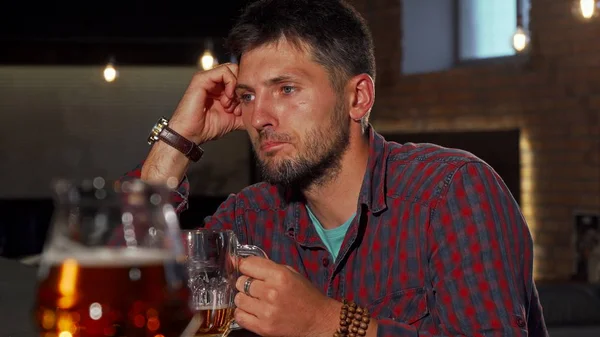 Depressed man drinking alone at the bar — Stock Photo, Image