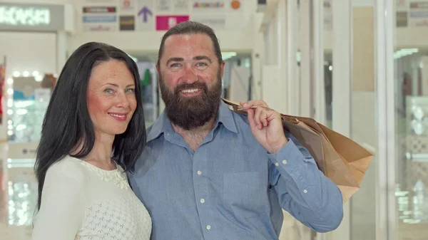 Sliding shot of a mature couple shopping at the mall together — Stock Photo, Image