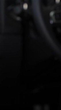 A close-up shot captures a thrilled young mans hand, adorned in a sleek suit, eagerly grasping the shiny car handle, symbolizing the joy of a new automotive adventure. This vibrant scene unfolds in a modern auto showroom, where the atmosphere buzzes