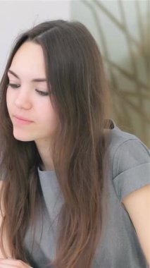 A dynamic young couple, deeply engaged in their innovative business project, collaborates at a sleek, modern office desk. The atmosphere buzzes with creativity and ambition as they analyze data on a laptop, sipping aromatic coffee while exchanging