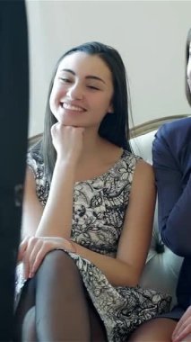 Two stylish girlfriends radiate excitement as they enthusiastically give thumbs up, showcasing their delight while trying on chic dresses. Their beaming smiles and playful expressions capture the essence of friendship and the thrill of a fun shopping