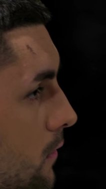 An expert barber focuses intently as he skillfully styles a mans hair with clippers, showcasing his artistry in a chic barbershop. The vibrant atmosphere buzzes with energy, filled with the scent of grooming products and the rhythmic sound of