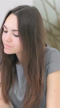 A focused young couple engages in a lively discussion with their business analyst in a sleek, modern office, surrounded by stylish decor. Their expressions radiate determination and enthusiasm as they strategize over a tablet, embodying the essence