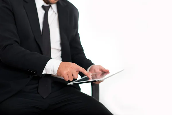Close up,businessman holding tablet in suit