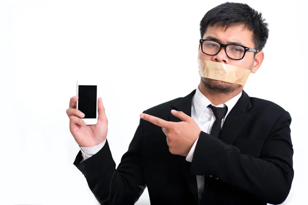 Businessman With His Arms Folded And His Mouth Taped Shut with hand holding phone,Businessman taking off duct tape on mouth on gray background