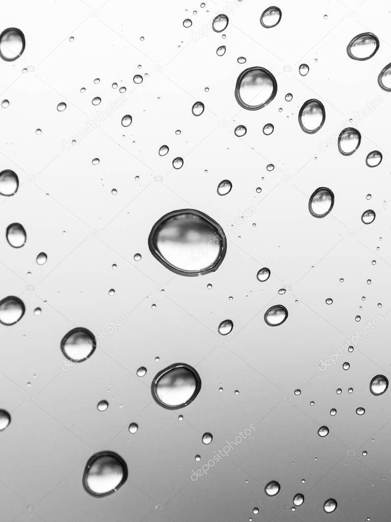 Rain drops on window pane, close up