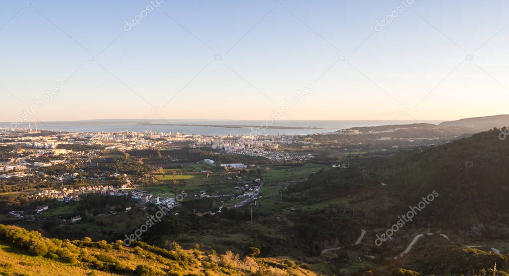 View of Setubal as seen from the Palmela Castle in Setubal District south of Lisbon in Portugal, at sunset.