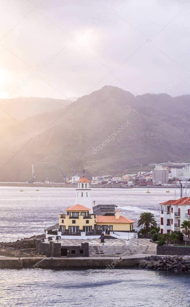 Lighthouse and town at sunset, Madeira island, Portugal