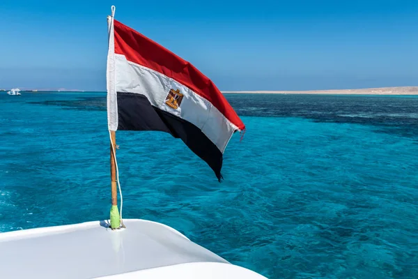 Egyptian Flag and Red Sea blue skysun