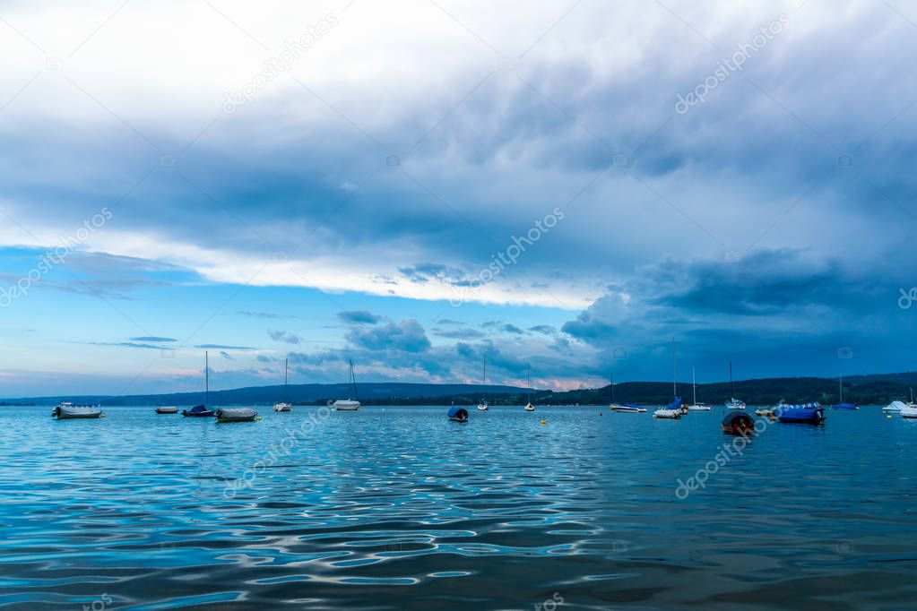 Storm pulls over the beautiful Bodensee summer with boats