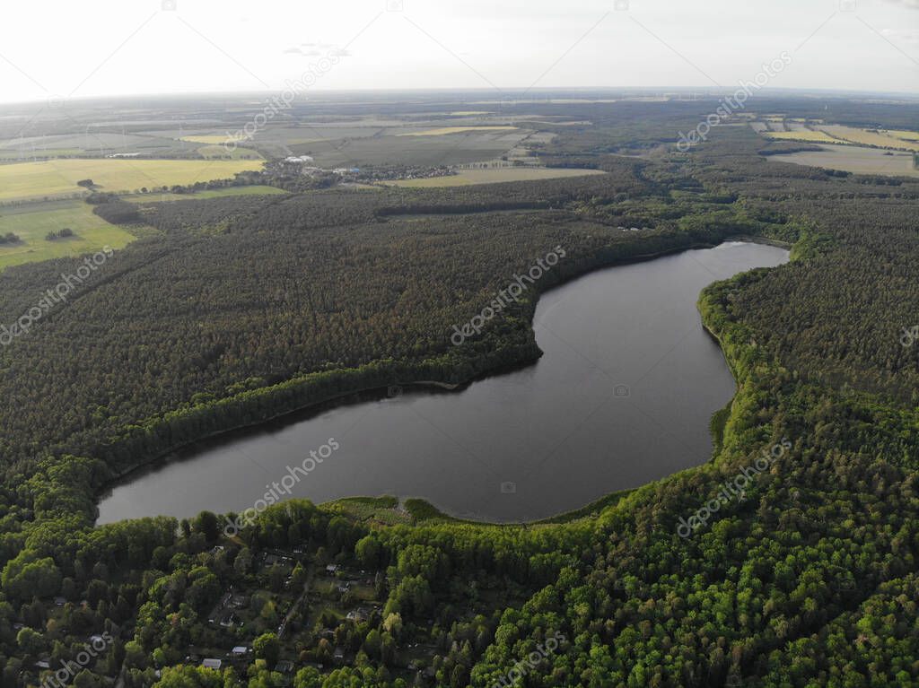 Aerial view of lake Fngersee near Strausberg (Brandenburg). Surrounding villages are Hirschfelde, Altlandsberg and Petershagen-Eggersdorf. The lake is located in the catchment area of Strausberg