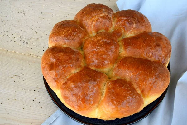 Home baked bread rolls / bread buns on wooden board