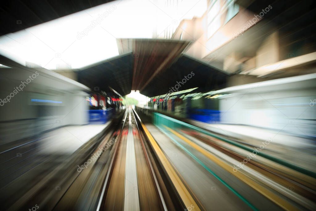 Motion blur photo of subway road, monorail, train station