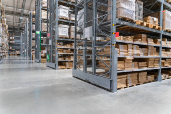 blurred background image of Rows of shelves with goods boxes in modern industry warehouse store at factory warehouse storage 