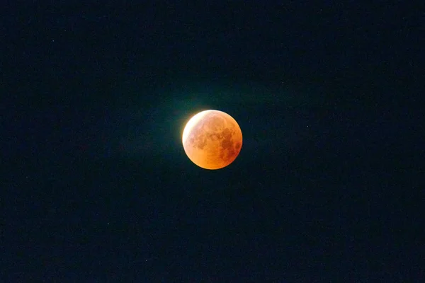 Red moon, total lunar eclipse.A total moon eclipse in the dark night sky.
