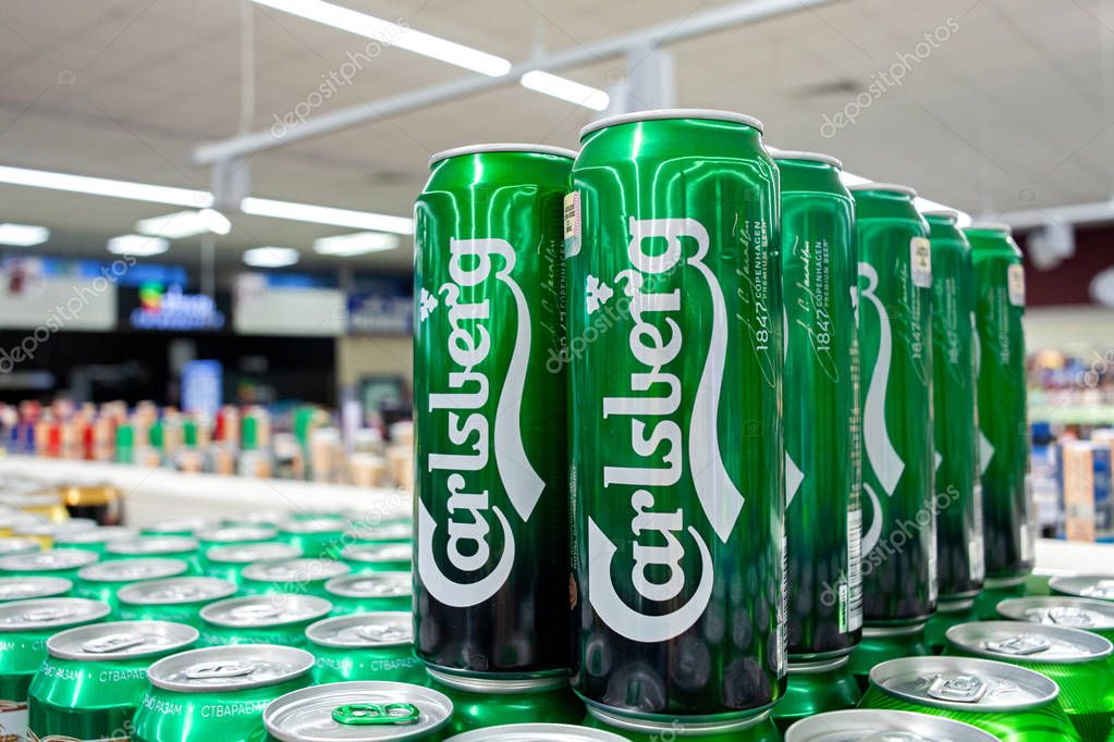 MINSK, BELARUS - October 4, 2019: Display with Carlsberg beer in cans in supermarket.