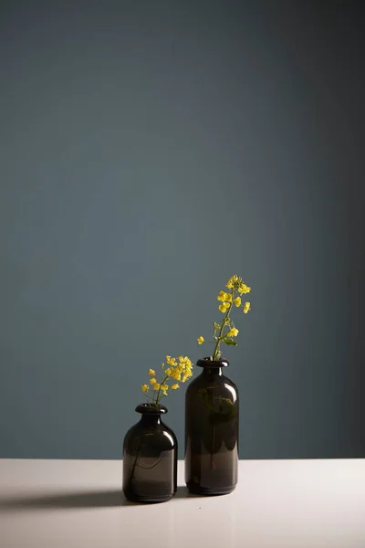 Small flowers in vases on a table