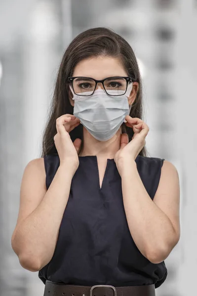 A girl showing wear the mask & protect herself for virus
