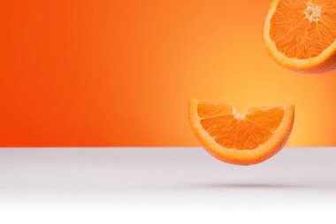 Floating oranges isolated on an orange and white background with space for text clipart