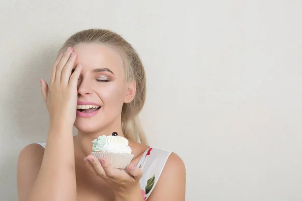 Happy Blonde Model Covers Her Face Hand Holding Sweet Cream — Stock Photo, Image