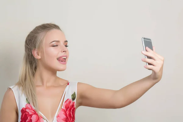 Playful Blonde Girl Showing Her Tongue Making Selfie Mobile Phone — Stock Photo, Image