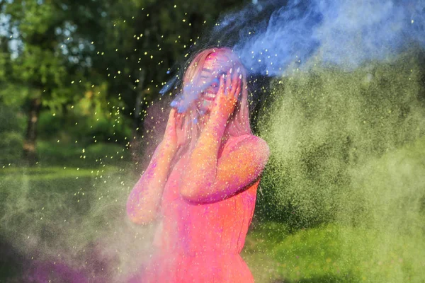 Emotional Blonde Woman Exploding Colorful Paint Celebrating Holi Festival — Stock Photo, Image