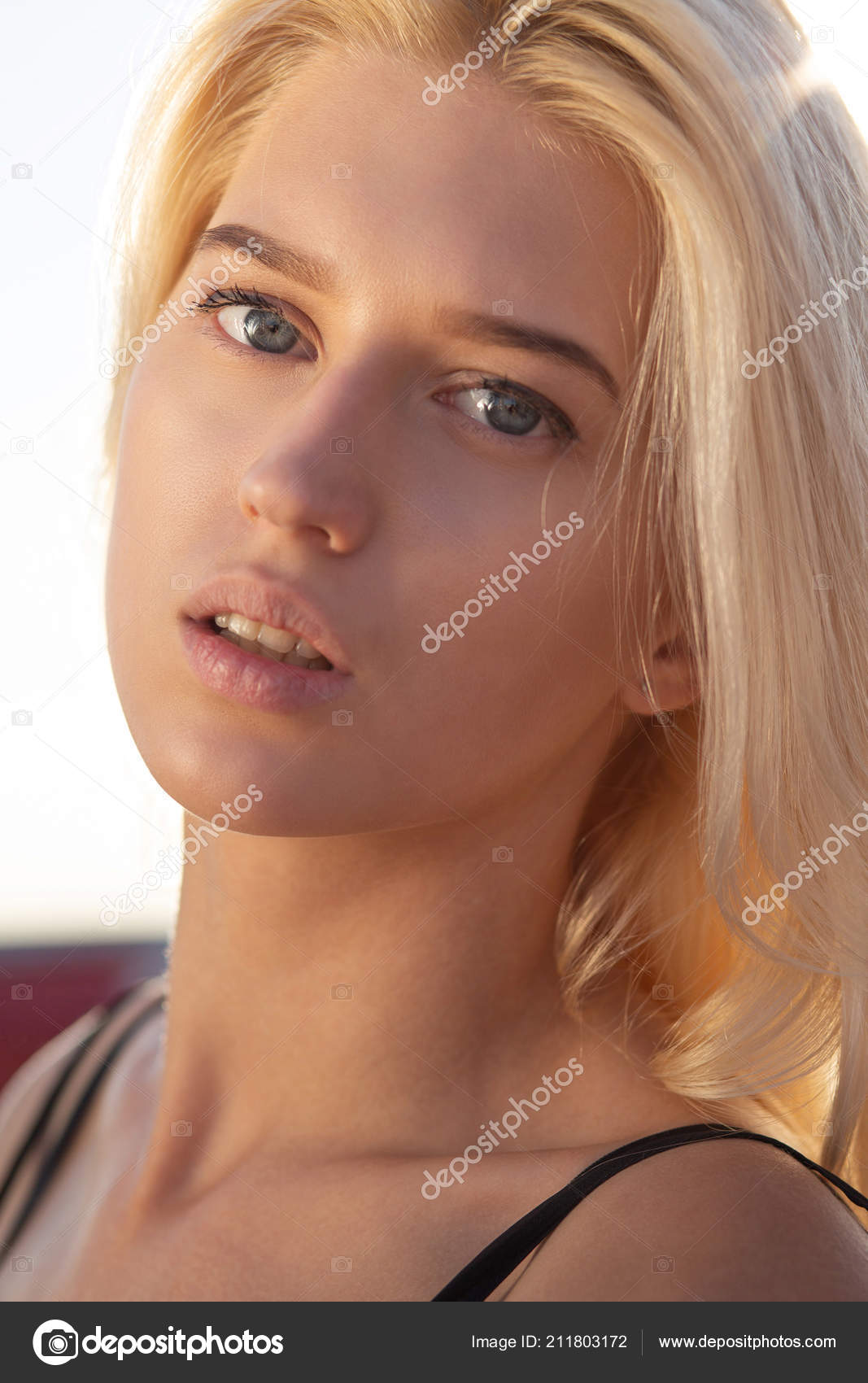 Gorgeous Blonde Blue Eyed Woman Natural Makeup Hair Looking Camera
