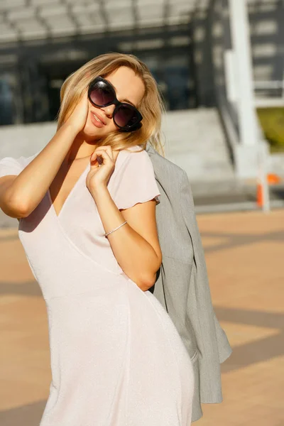 Lifestyle Portrait Flirty Young Woman Trendy Dress Holding Grey Jacket — Stock Photo, Image