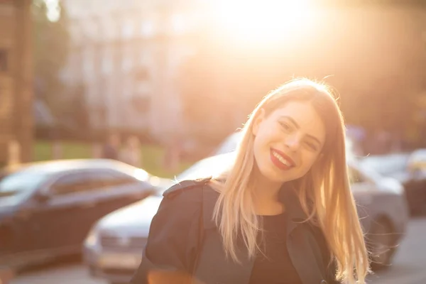 Cheerful Young Woman Coat Posing Road Rays Sun Empty Space — Stock Photo, Image